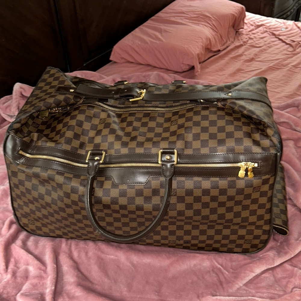 Louis button duffle bag luggage